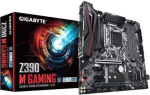 Imagem da Placa-mãe Intel Z390 Gaming. É possível ver a placa mãe, em primeiro plano, na parte direta da imagem, e caixa da placa, em segundo plano, na parte esquerda da imagem. A placa é toda preta, com detalhes em prata e vermelho. A caixa é da mesma cor, "gigabyte" escrito em letras brancas na parte de cima e "Z390 M Gaming", primeira palavra em letras brancas e as demais em vermelho, na parte inferior.